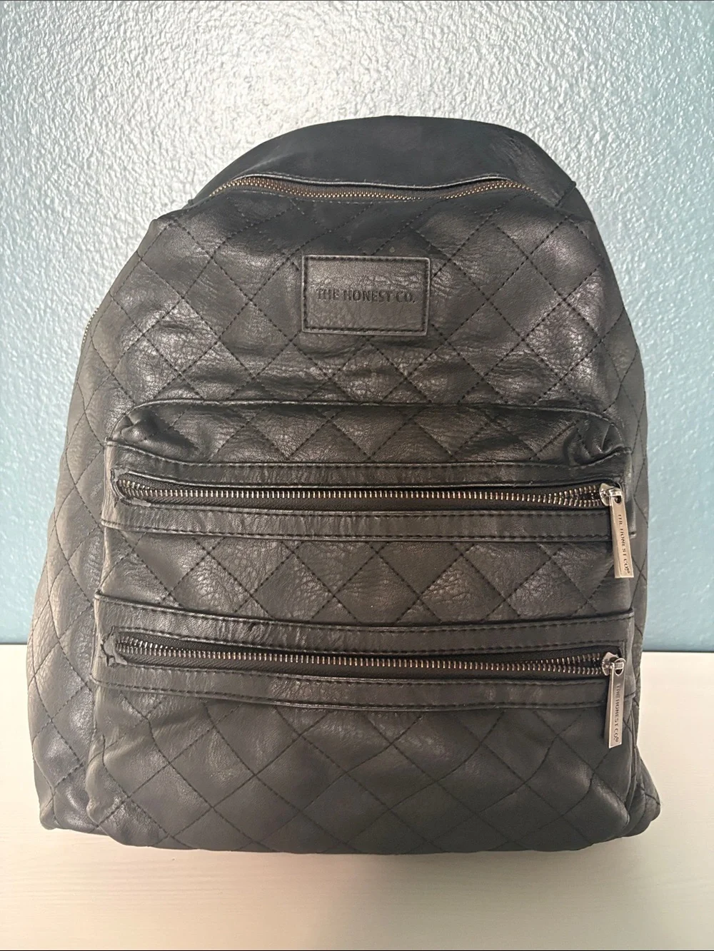 The Honest Company Diamond Quilted Black Faux Leather Backpack